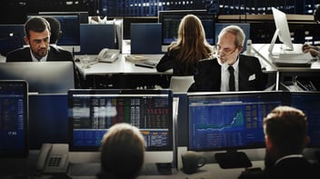 Financial professionals analysing data
