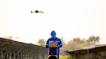 Man ispecting with drone