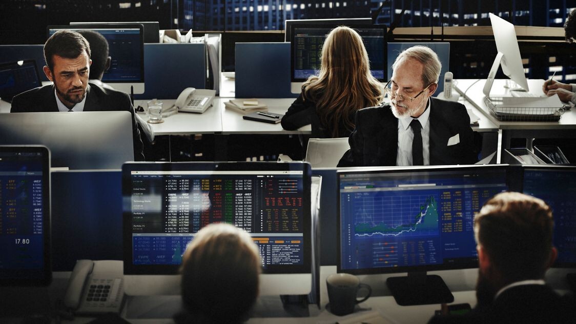 Financial professionals analysing data